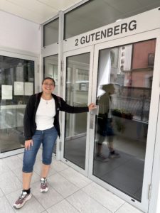 Dina at her old apartment building in Geneva. 